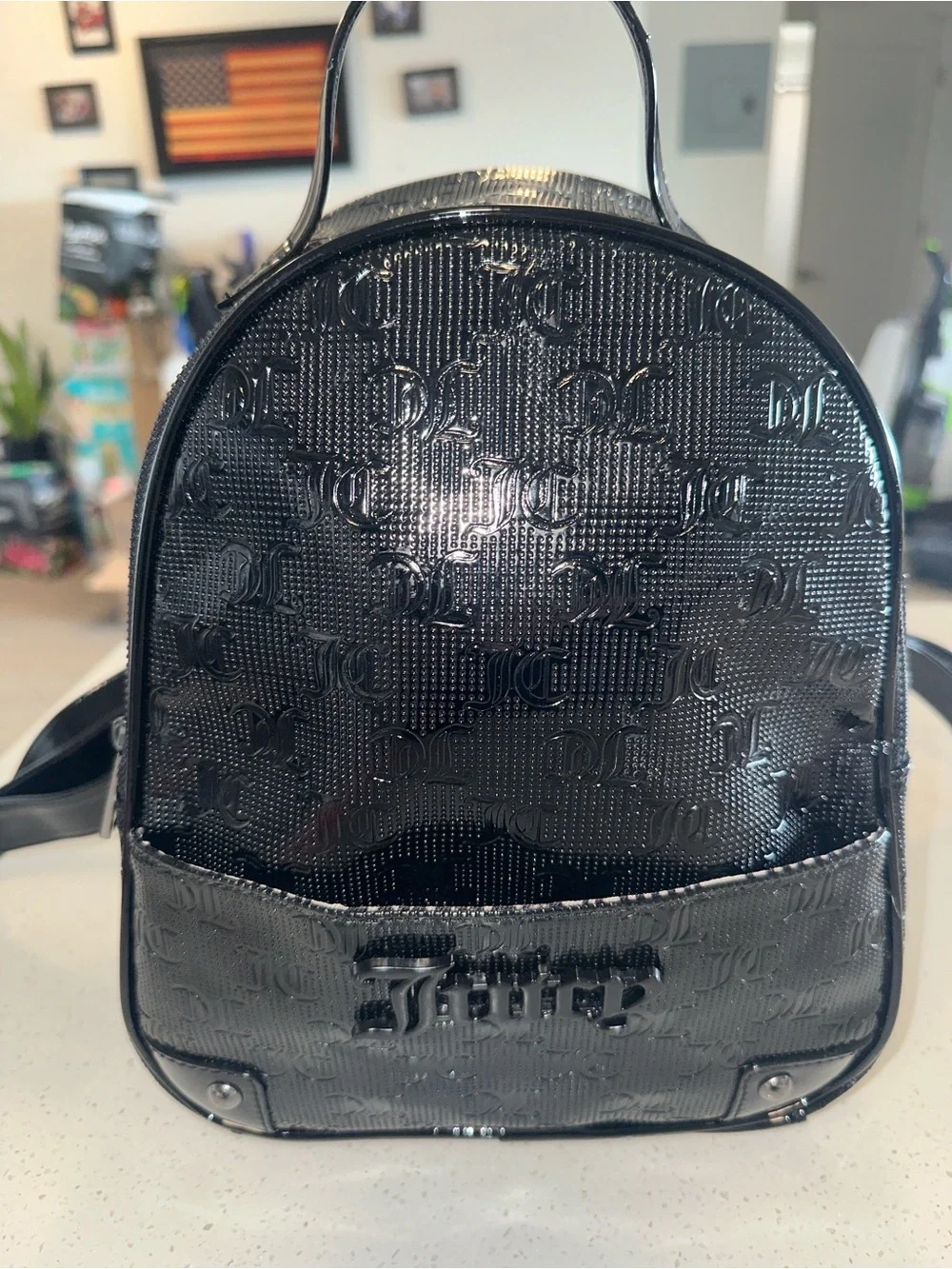 Juicy Couture Black Patent Mini Backpack, new without tags. Excellent condition.